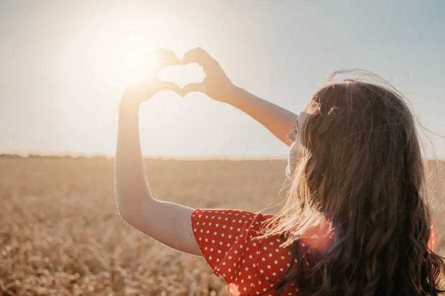 woman outside soaking in vitamin D from the sun